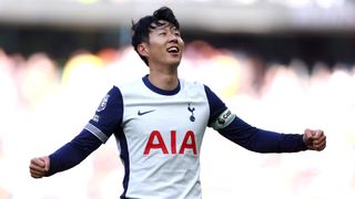 Heung-Min Son celebrates scoring a goal for Spurs in his blue and white Tottenham home kit.