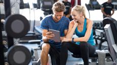 Woman with personal trainer in gym